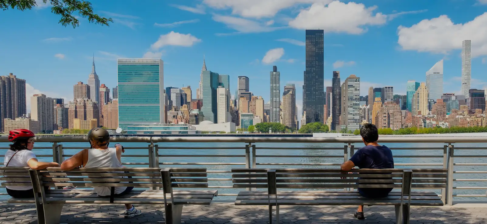 NewYorkers at a park in Queens with a view of the midtown Manhattan skyline