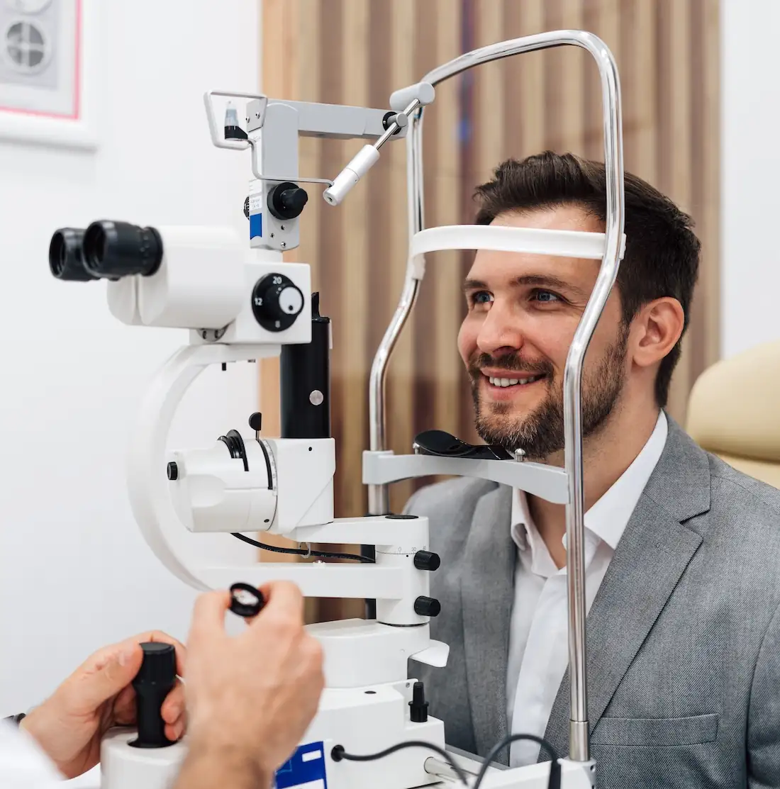 Middle-aged businessman consulting with eye doctor